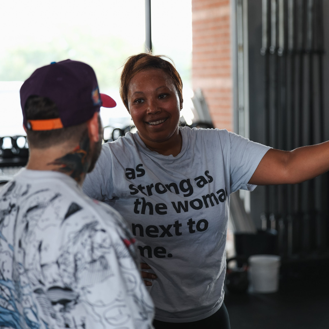 Member with strong woman shirt