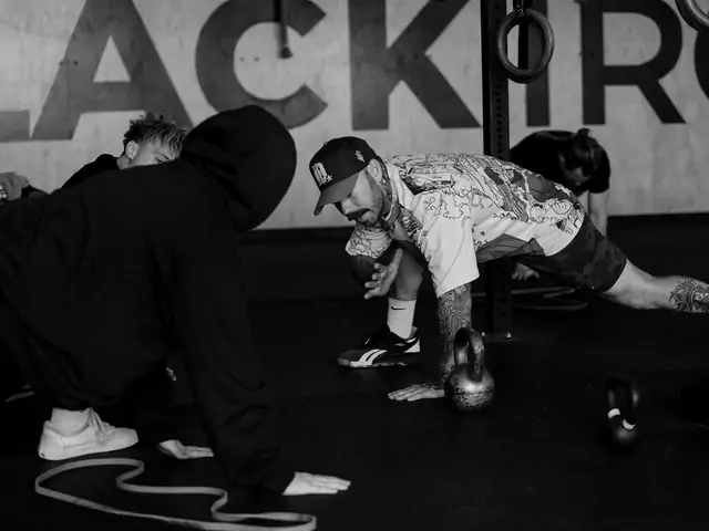 A coached class warming up on the floor