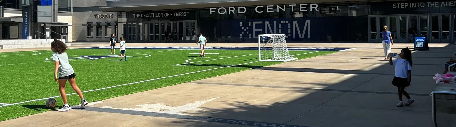 XENOM Frisco review - the Ford Center at The Star with XENOM signage